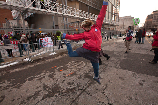 Power Shift 2009, Washington DC. Students from across the country assemble to march on and protest outside the coal fired power plant that supplied Capitol Hill with power. Activists were led by writer Wendell Berry, NASA scientist Jim Hansen, Terry Tempest Williams, writer/activist Bill McKibbben, actress Daryl Hannah and others in an act of civil disobedience, the 1st large scale action. Dancer Jessie Carrier from Salt Lake City dances to entertain protesters and to keep warm. : Tim DeChristopher : Sallie Dean Shatz